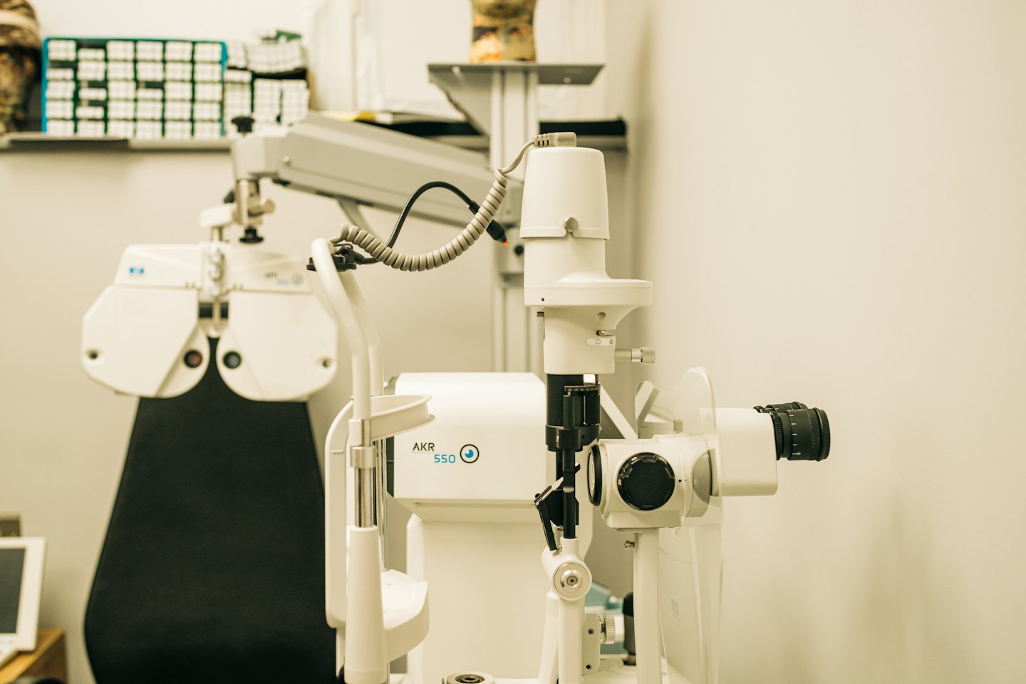 Modern optometry equipment sits ready inside a clean medical clinic.